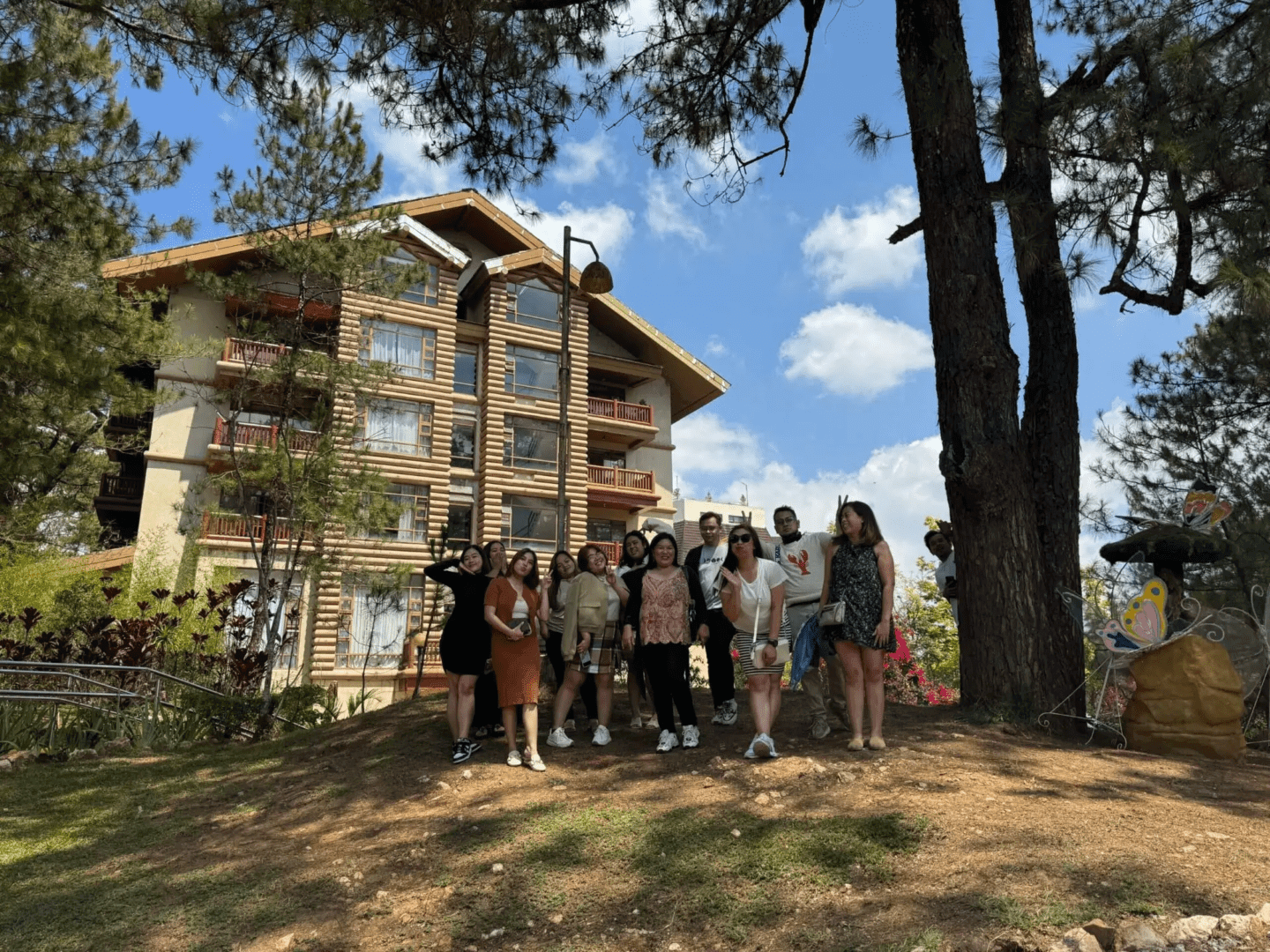Group posing in front of a building.